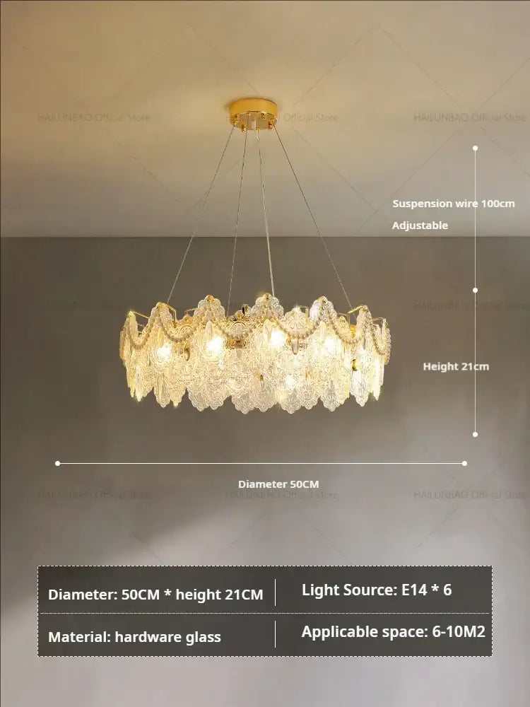 Elegant gold-toned decorbites glass chandelier with cascading clear faceted glass for luxury dining room decor
