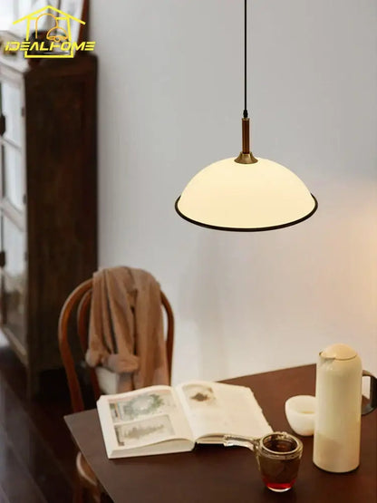 A warm cream glass french medieval saucer pendant light with brass trim ideal for dining room decorbites pendant lights