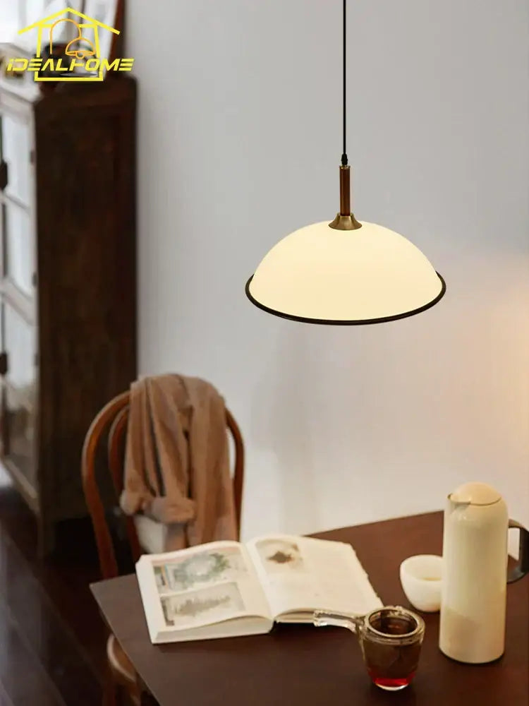 A warm cream glass french medieval saucer pendant light with brass trim ideal for dining room decorbites pendant lights