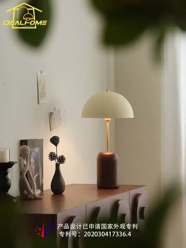 Cream-colored dome table lamp with gold-toned stem and dark wood base for decorbites french medieval solid wood bedroom