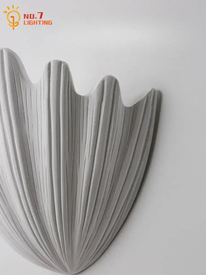 Gray french medieval wall lamp with shell shape ribbed gypsum design and matte finish for bedroom decorbites french medieval