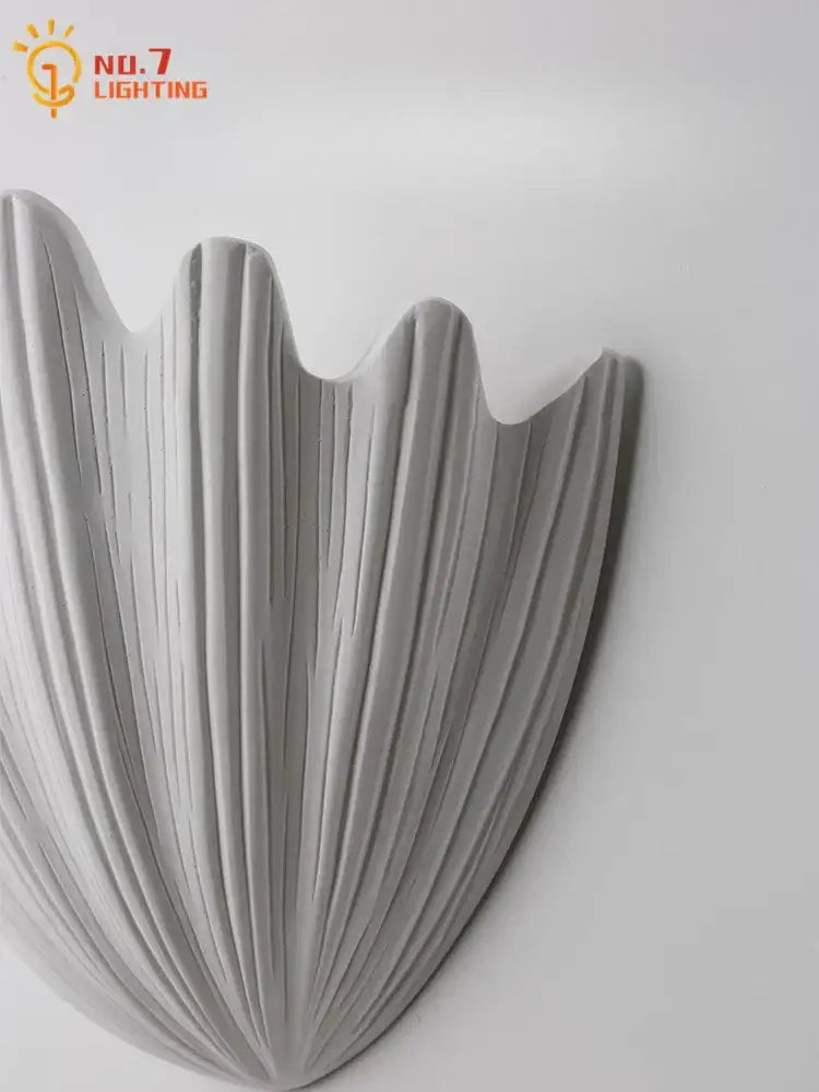 Gray french medieval wall lamp with shell shape ribbed gypsum design and matte finish for bedroom decorbites french medieval