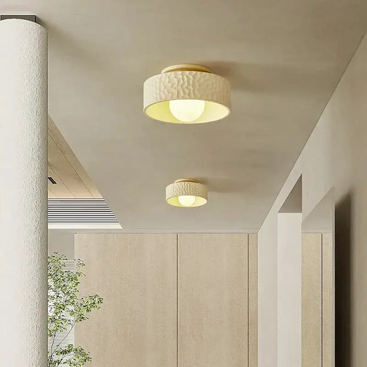 Cream-colored textured ceiling light with warm diffused glow decorbites french minimalist cream for living room decor