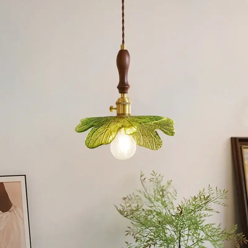French minimalist green glass pendant lamp with copper wood decorbites handle and brass accents for dining room decor