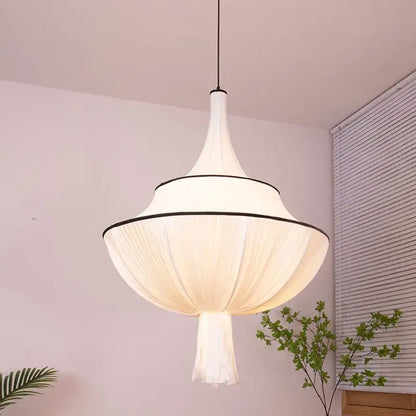 A modern white pendant lamp with soft pleated silk shade and black trim for decorbites french minimalist living room decor