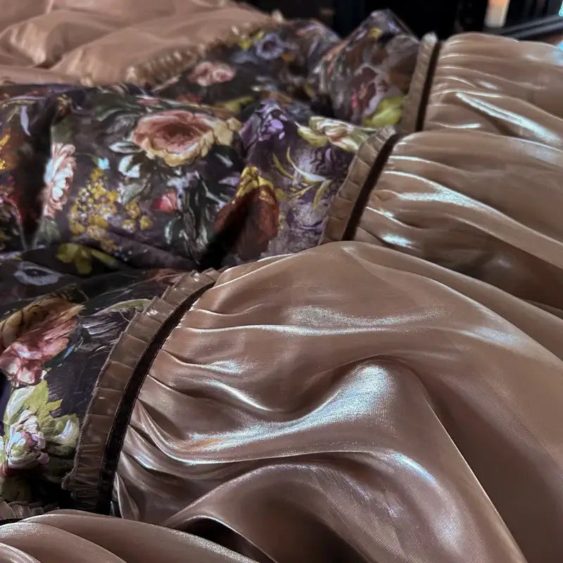 A plush metallic bronze satin pillow sham with ruffled edge and floral pattern from decorbites french organza lace bedding set