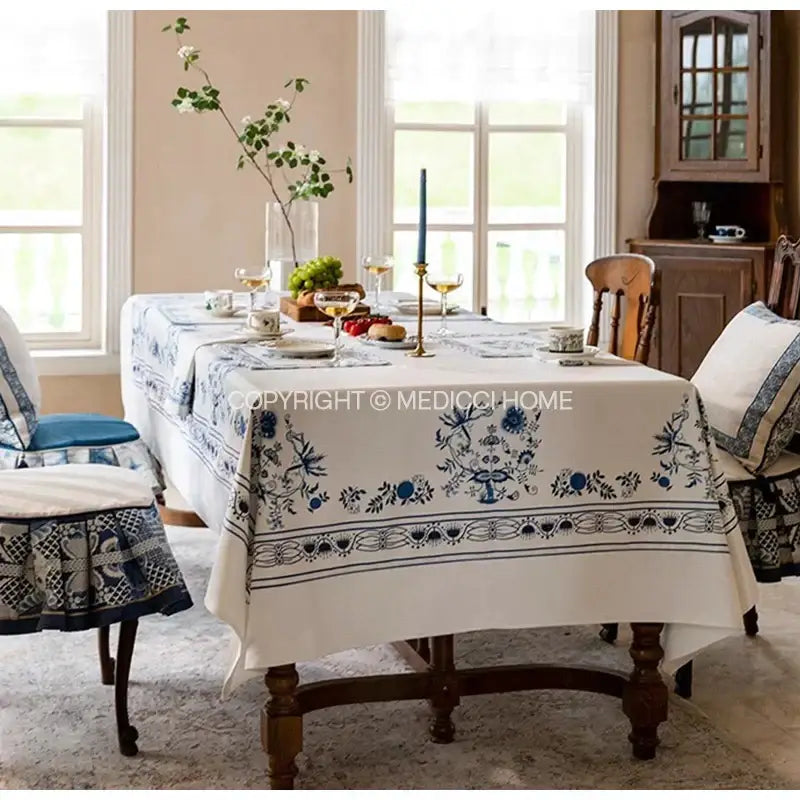 Elegant ivory blue onion print tablecloth with intricate floral embroidery and decorative border for dining room decorbites blue onion decor