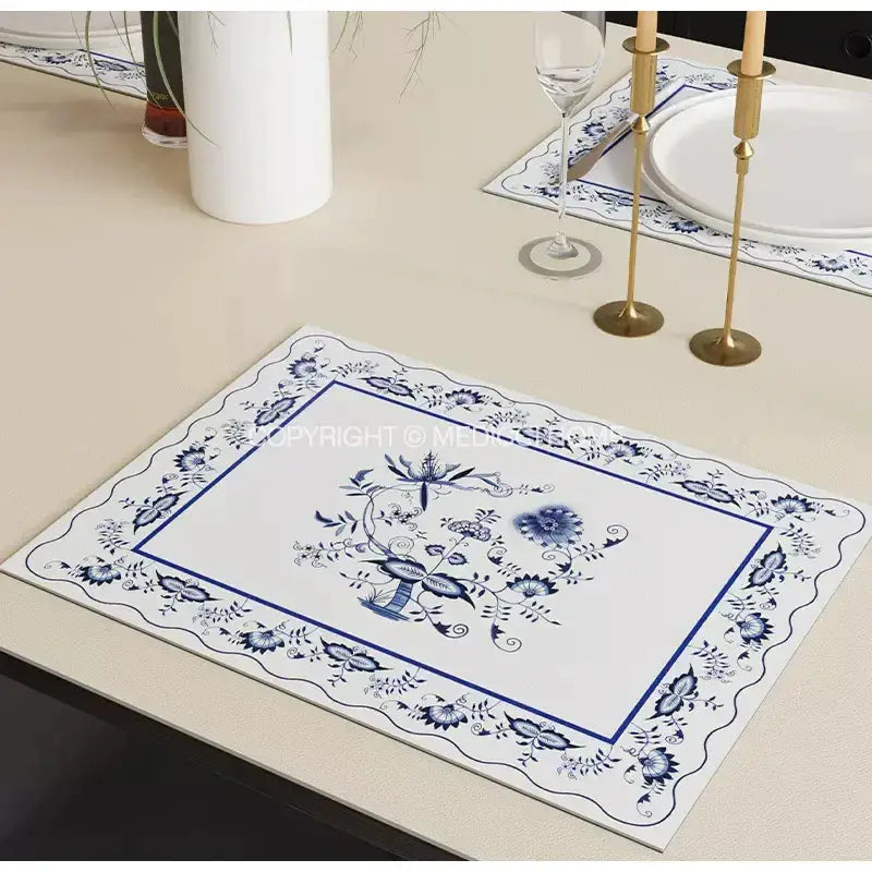 Blue and white ceramic placemat featuring intricate floral blue onion print for decorbites blue onion tablecloth decor