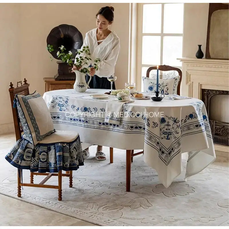 White tablecloth with intricate blue onion print embroidery for elegant dining room decorbites blue onion style