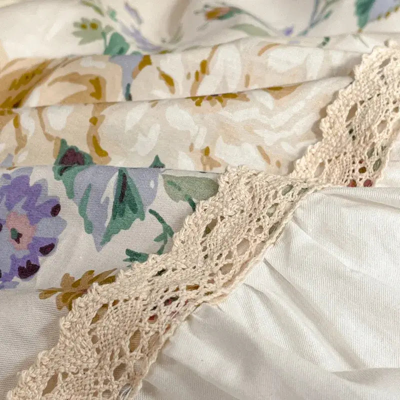 A delicate cream crochet lace trim with intricate openwork edged on floral cotton fabric of french pastoral princess bedding set