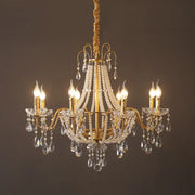 Gold-toned decorbites french pearl chandelier with six lit candle-style bulbs and crystal droplets for living room pendant lighting
