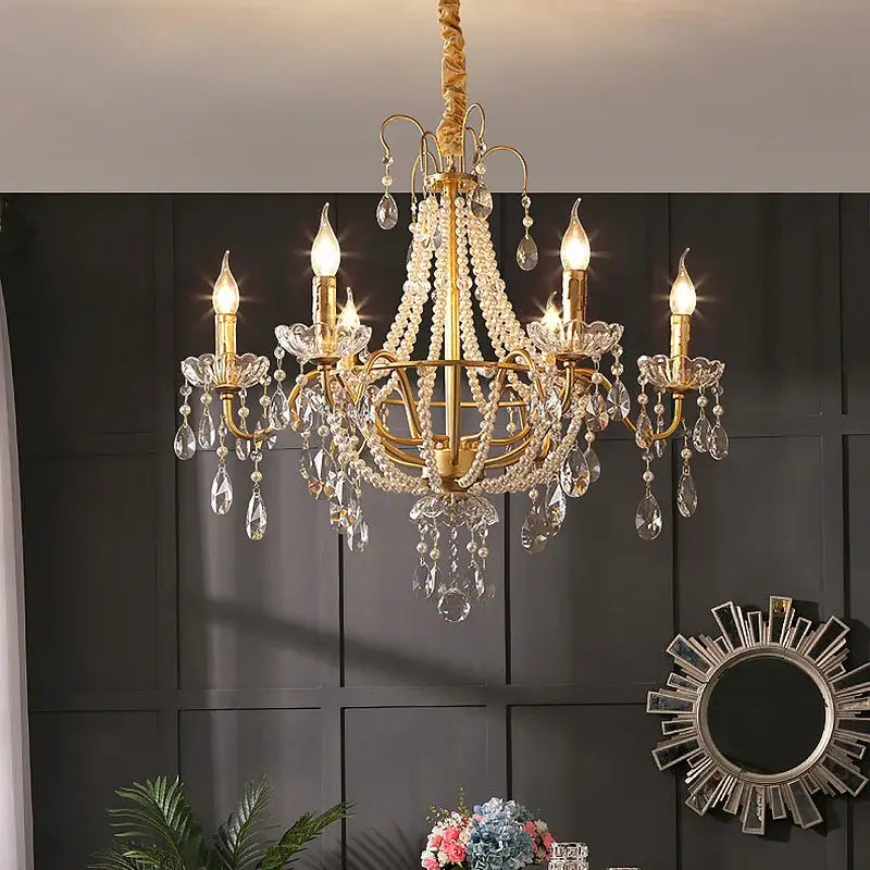 Gold-toned decorbites french pearl chandelier with intricate crystal droplets and candle-style bulbs for living room decor