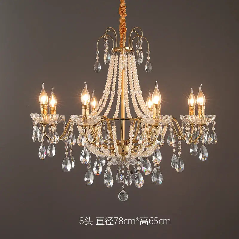 Gold-toned decorbites french pearl chandelier with six lights, crystal droplets, and candle-style bulbs for living room decor