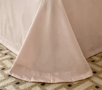 A soft blush-colored bed skirt with delicate pleated hemline from decorbites french princess 1000tc bedding set
