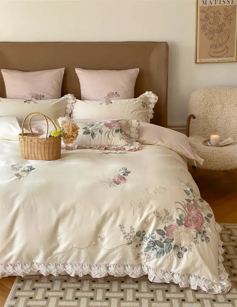 Cream-colored satin duvet cover with pink green floral embroidery and lace trim from decorbites french princess 1000tc bedding set