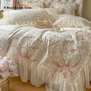 Cream-colored bedding set with pink and silver floral embroidery ruffled edges soft textured fabric decorbites french princess
