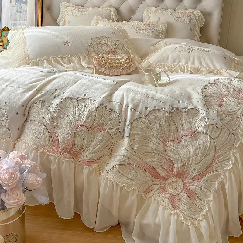 Cream-colored bedding set with embroidered floral blossoms and ruffled edges decorbites french princess wedding style