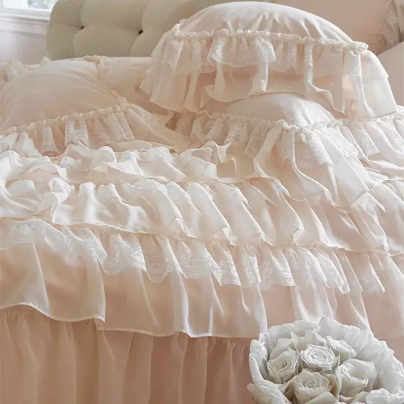 A delicate cream and blush pink ruffled bedding set with lace trim by decorbites french princess for elegant bedroom decor