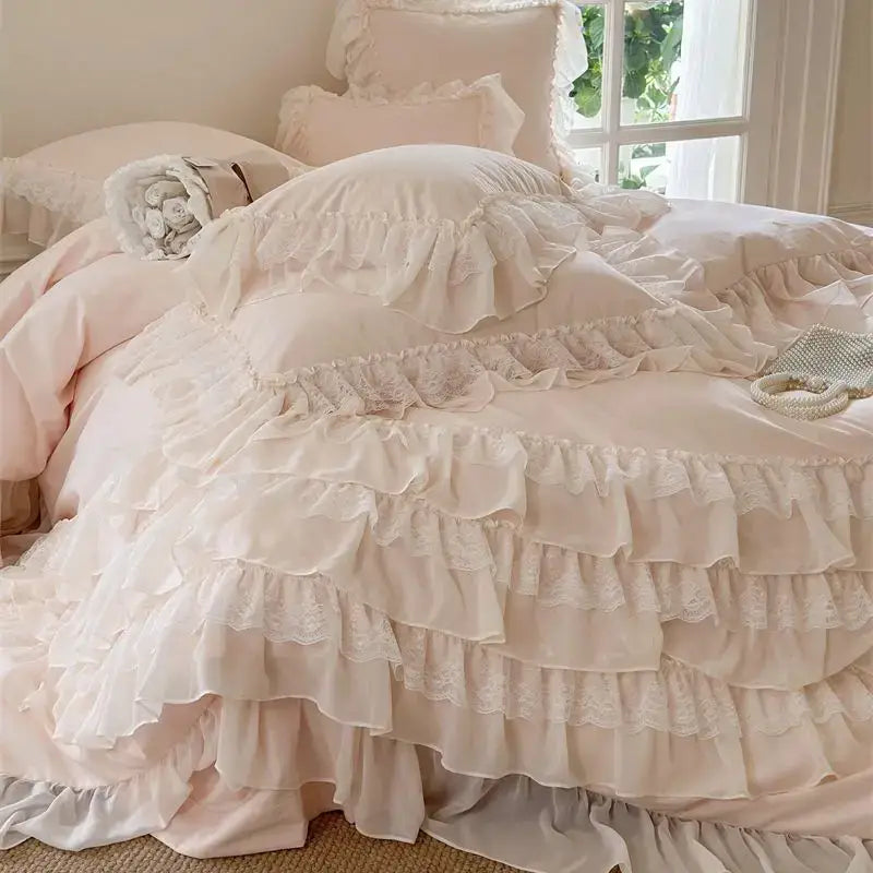 A soft blush pink decorbites french princess bedding set with ruffles and layered lace trim for elegant bedroom decor