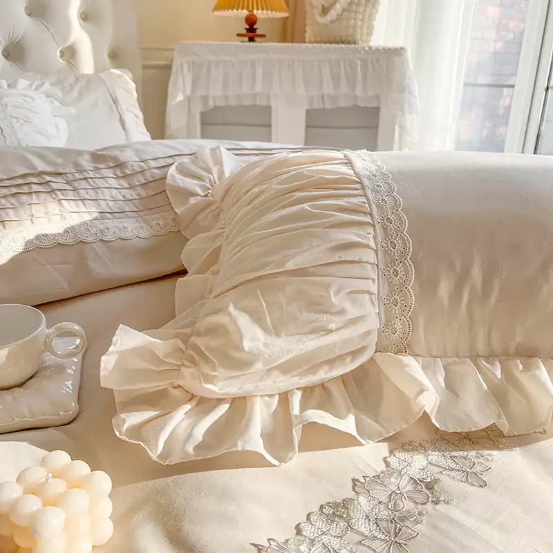 Cream-colored satin pillowcase with lace trim and ruffled edges from decorbites french princess bedding set