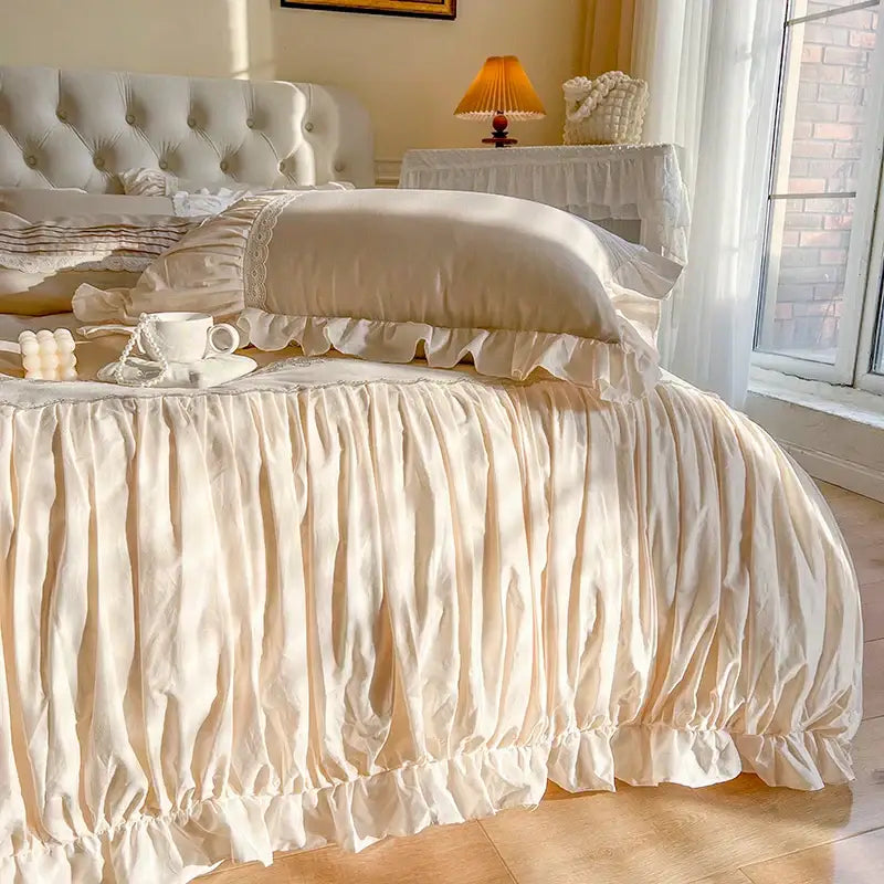 Cream-colored ruffled bed skirt with gathered fabric and lace trim from decorbites french princess bedding set