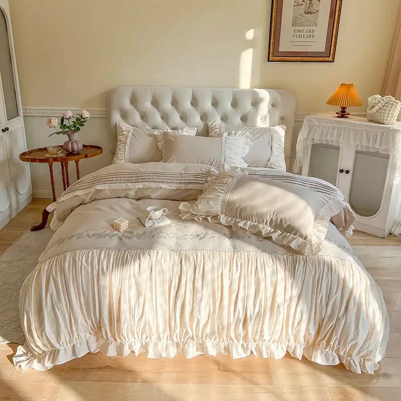 Cream-colored satin bedding set with ruffled edges and lace trim from decorbites french princess collection for elegant decor