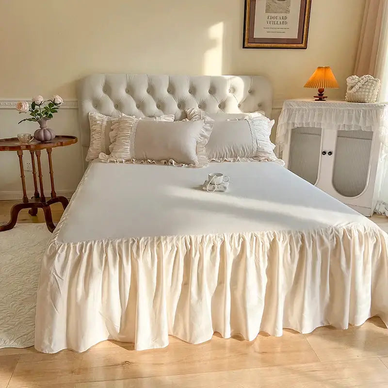 Cream-colored ruffled bed skirt with soft flowing fabric from decorbites french princess cotton bedding set with flower embroidery