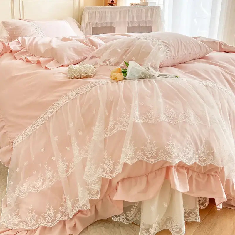 Pink ruffled bedding set with delicate white lace trim and layered sheer fabric from decorbites french princess lace collection