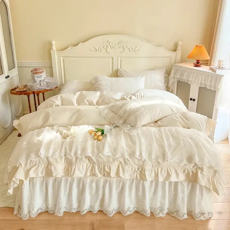 Cream-colored layered ruffled cotton bedding set with delicate lace trim from decorbites french princess lace collection