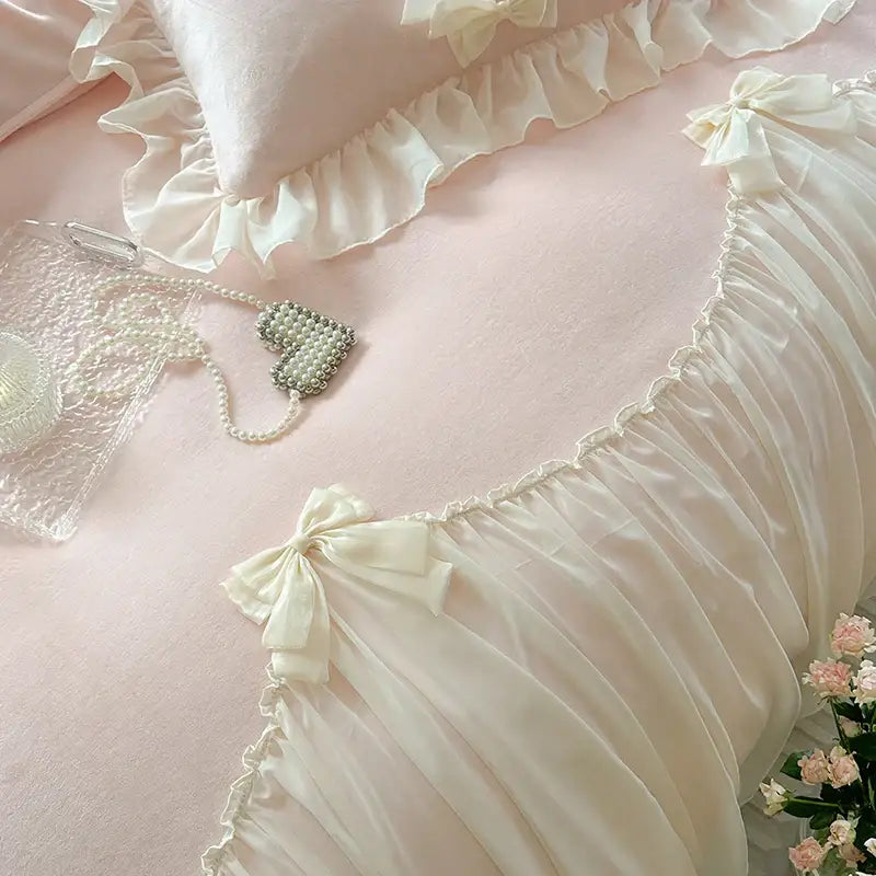 Cream-colored satin pillow with delicate ruffled edges and bow from decorbites french princess lace bedding set