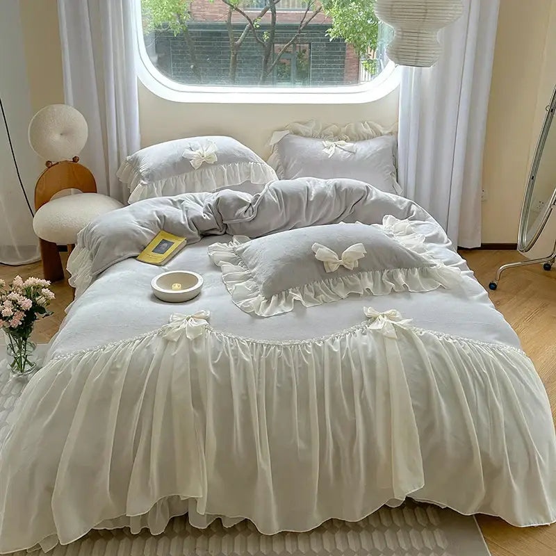 A soft off-white bedding set with ruffles lace trim and butterfly embellishments from decorbites french princess lace collection