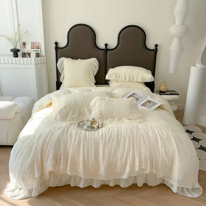 Cream-colored french princess white ruffled lace bedding set with delicate lace detailing and soft flowing fabric