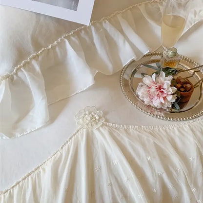Off-white velvet ruffled skirt with delicate star embroidery and floral waist embellishment in decorbites french princess bedding set