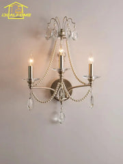 Antique brass three-light wall lamp with dangling crystal teardrops and pearl beads for french retro decorbites decor