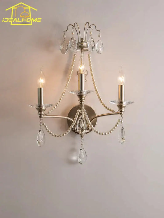 Antique brass three-light wall lamp with dangling crystal teardrops and pearl beads for french retro decorbites decor