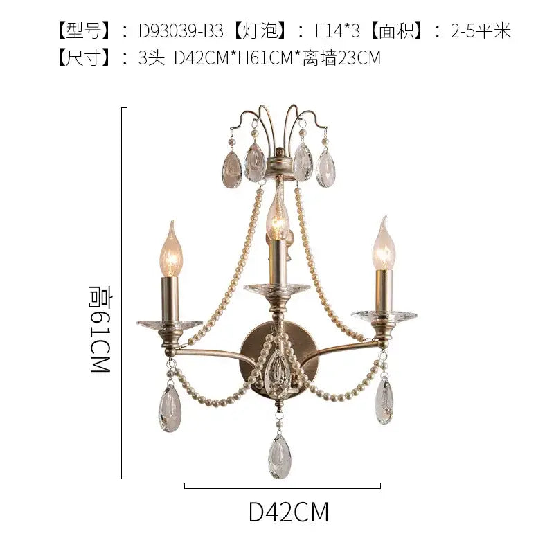Antique brass three-light wall lamp with crystal teardrops and pearl chains in french retro decorbites style for living room