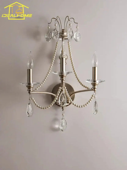 Antique brass three-light wall lamp with dangling crystal teardrops and pearl-like beads for french retro decorbites decor