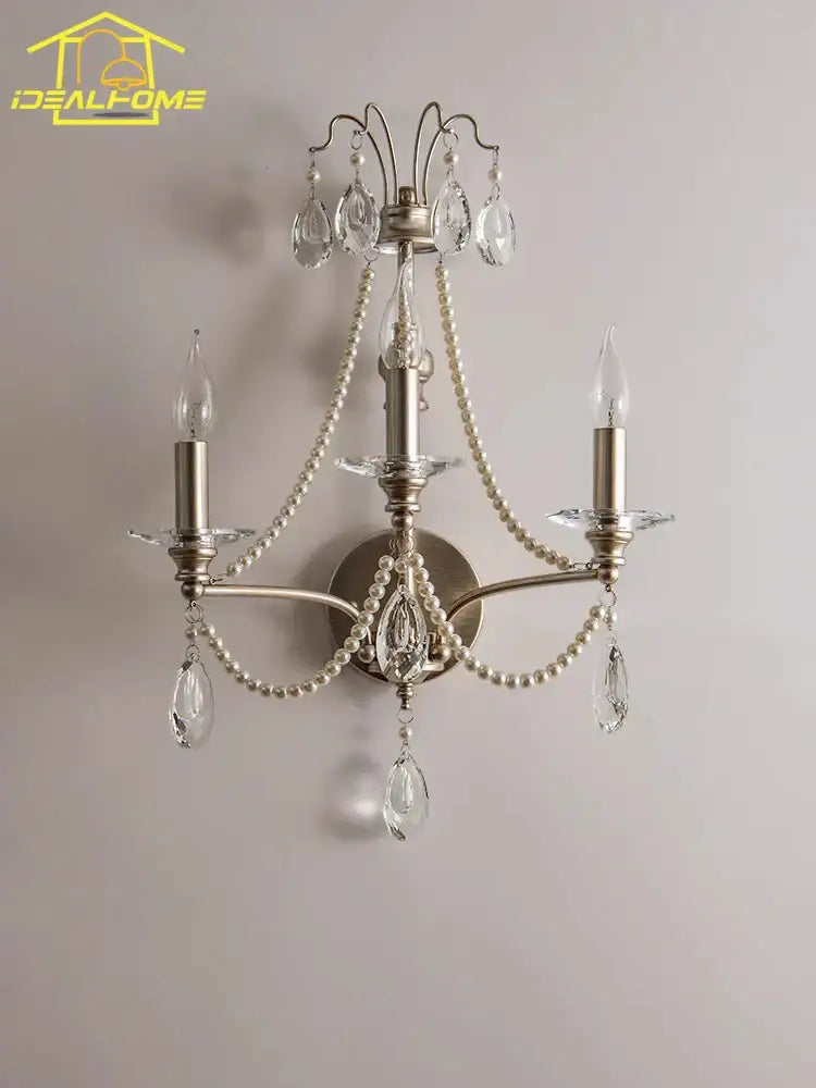 Antique brass three-light wall lamp with dangling crystal teardrops and pearl-like beads for french retro decorbites decor