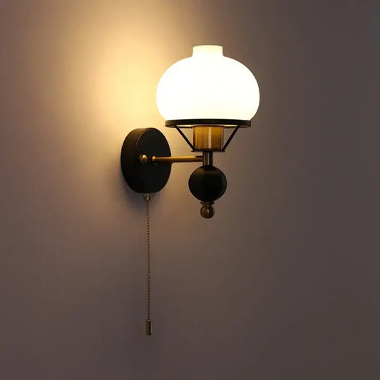 Vintage french retro wall lamp with frosted white glass globe brass accents and black metal bracket for living room use