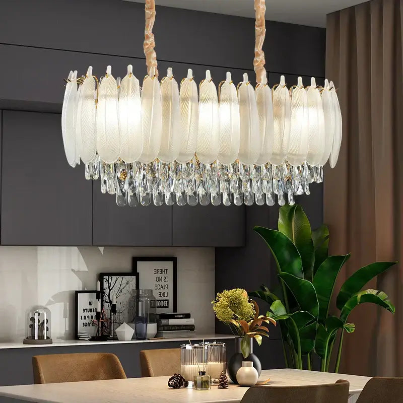 Elegant oval decorbites crystal feather chandelier with frosted glass shades and gold-toned chain for dining room decor