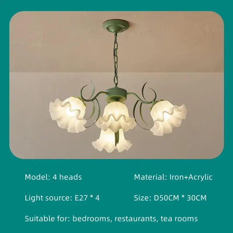 A delicate four-head french retro led flower chandelier with matte green iron frame and white acrylic shades for bedroom decorbites french retro