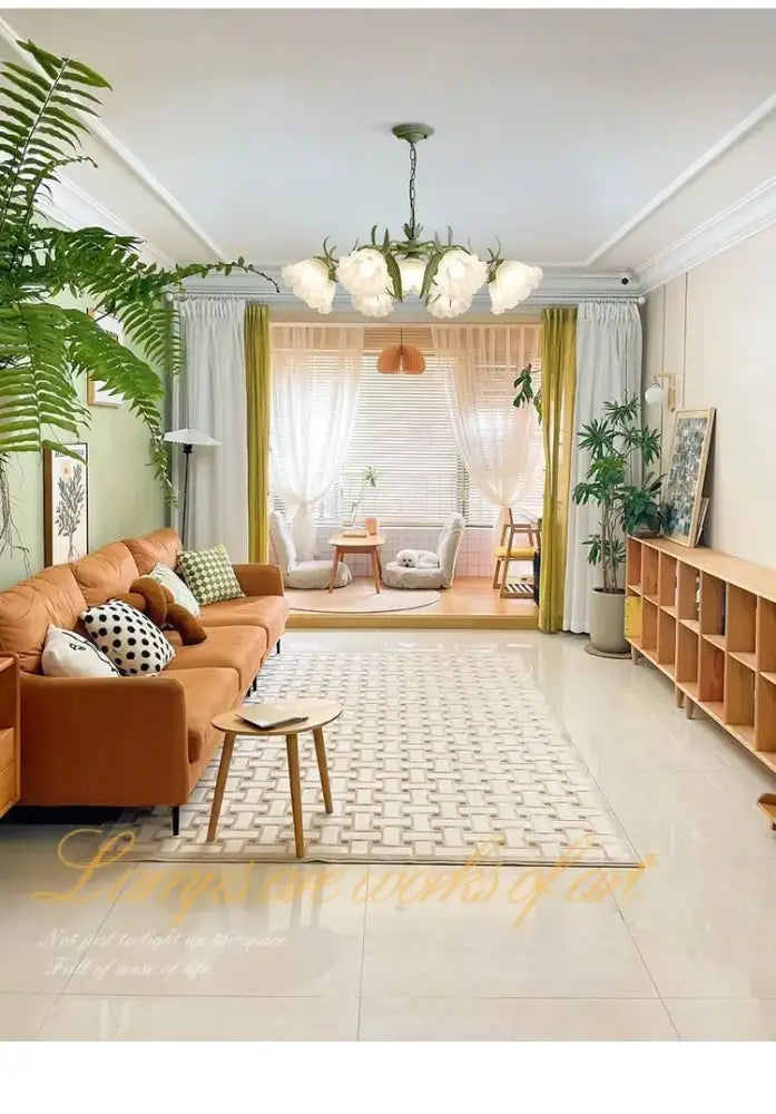 Orange leather sofa with patterned throw pillows under a decorbites french retro led flower chandelier bedroom pendant light