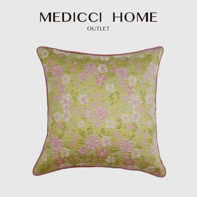 A light green square decorbites contessa camellia throw pillow with delicate pink white floral embroidery for living room decor