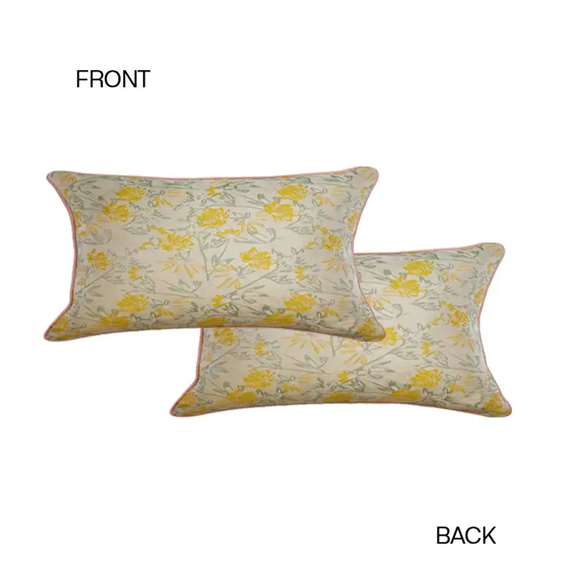 Cream-colored contessa camellia throw pillow with yellow green floral pattern and pink piping for living room decorbites decor