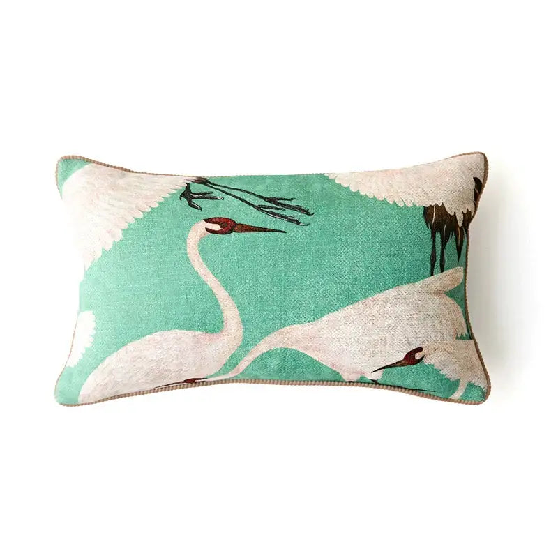 Rectangular decorative cushion cover with embroidered white cranes on teal velvet and brown trim for living room