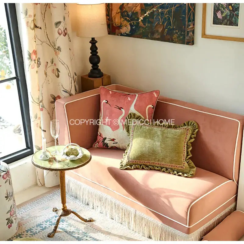 Pink velvet sofa with white piping and fringe trim featuring a french retro pink velvet decorative cushion cover