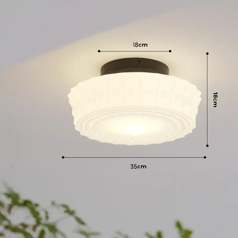 Rounded white frosted glass ceiling light with dark metal base in french retro shanghai style dining room pendant decorbites french retro
