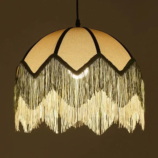 A warm-toned french retro style woven fabric fringed pendant lamp with cascading tassels for retro style bedroom decorbites french retro