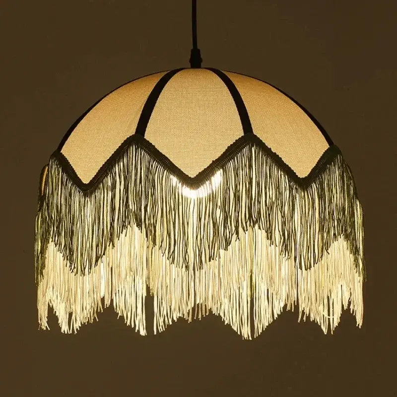 A warm-toned french retro style woven fabric fringed pendant lamp with cascading tassels for retro style bedroom decorbites french retro