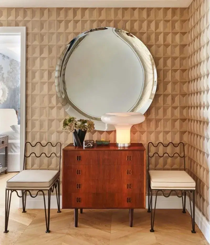 A polished round mirror with a sleek silver frame above a wooden chest complements the decorbites french retro wave dining table set